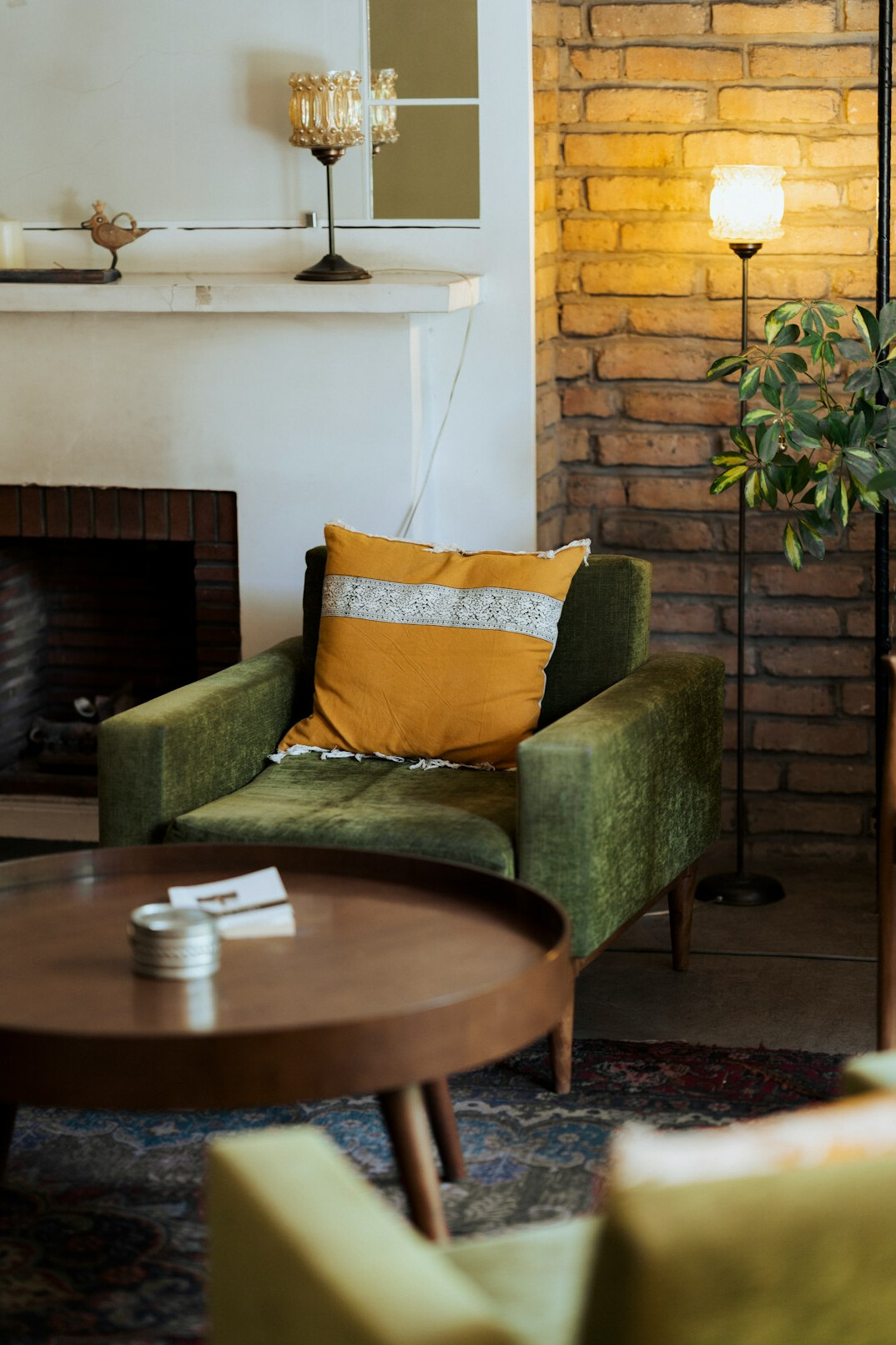 Elegant retro-modern living room with velvet armchairs and warm lighting