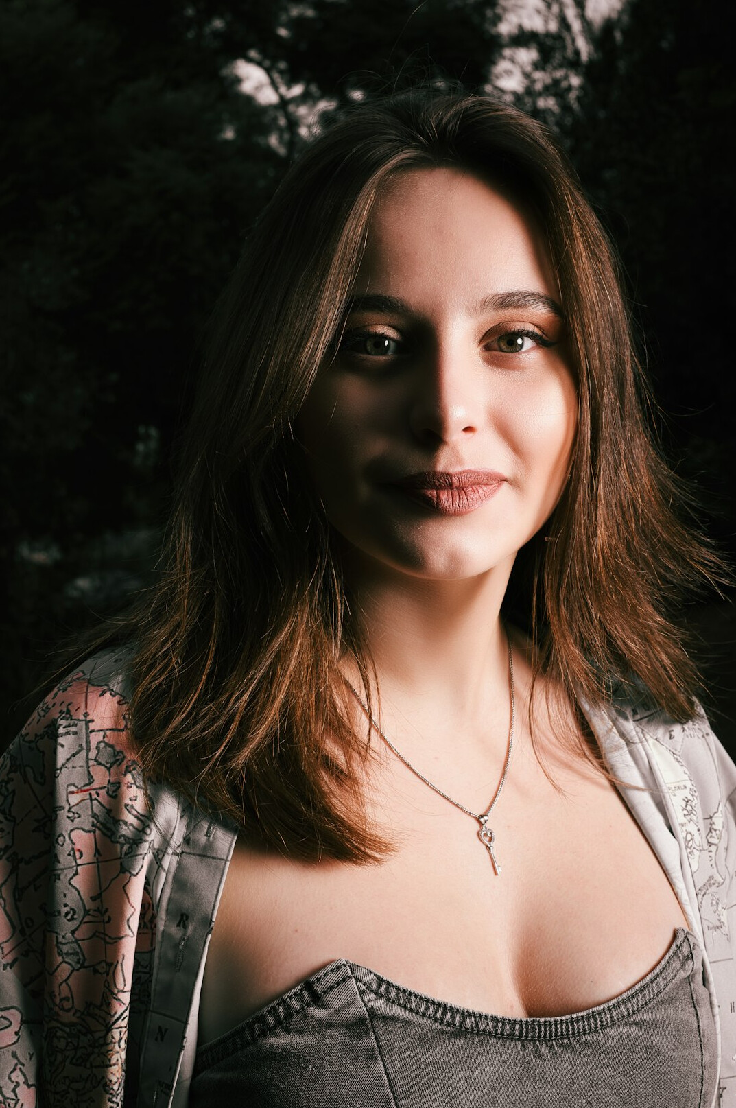 Studio portrait of a Swiss woman in her forties smiling, editor in chief